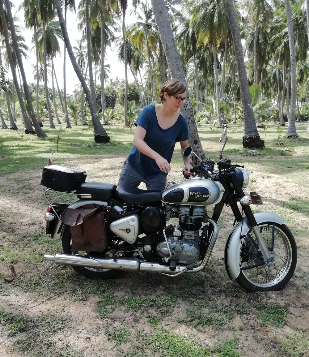 Woman on Royal Enfield motorcycle